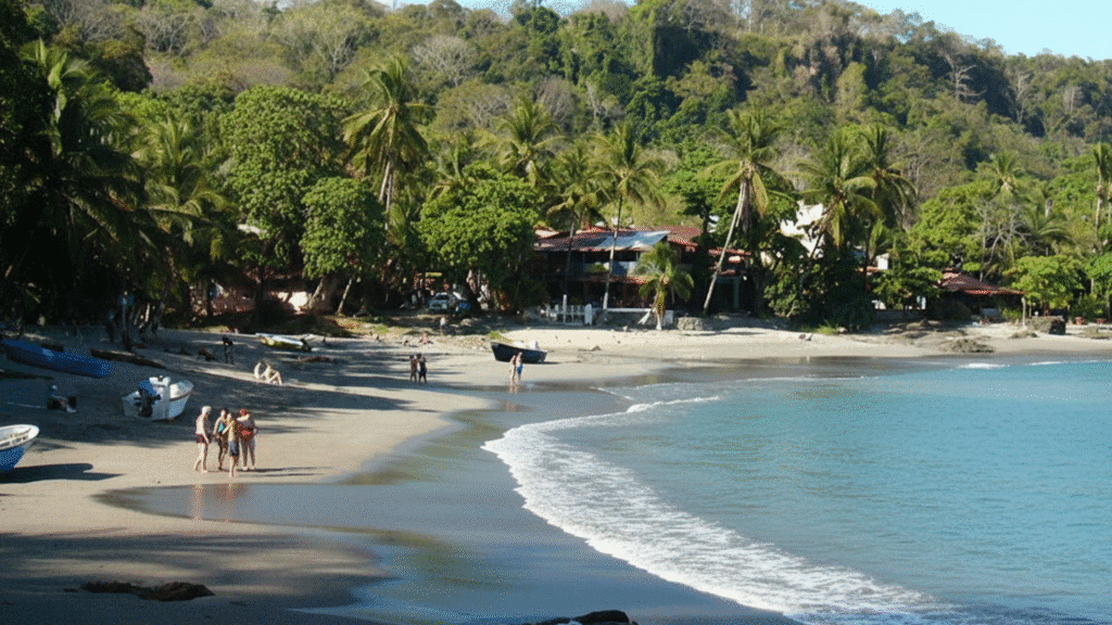 Montezuma Beach Costa Rica with jungle waterfalls, palm trees and bohemian travelers relaxing on the sand